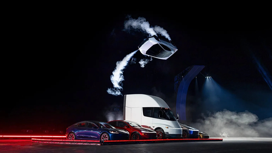 Een Tesla Roadster vliegt over een 5 andere Tesla modellen via een 360 jump