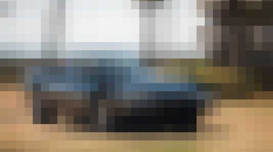 Illustratie voor: Antraciete Ferrari 365 Daytona Spider uit 1969