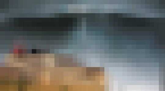 Illustratie voor: Man pakt golf van 23 meter en zet record voor hoogste golf in Guiness Book of Records